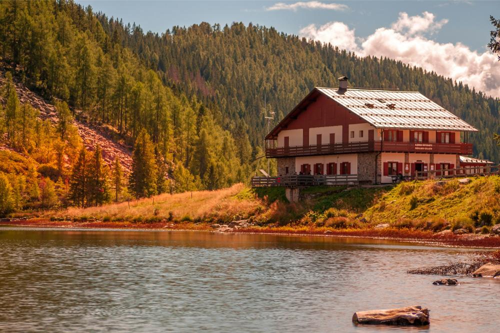 Mountain lodge by serene lake